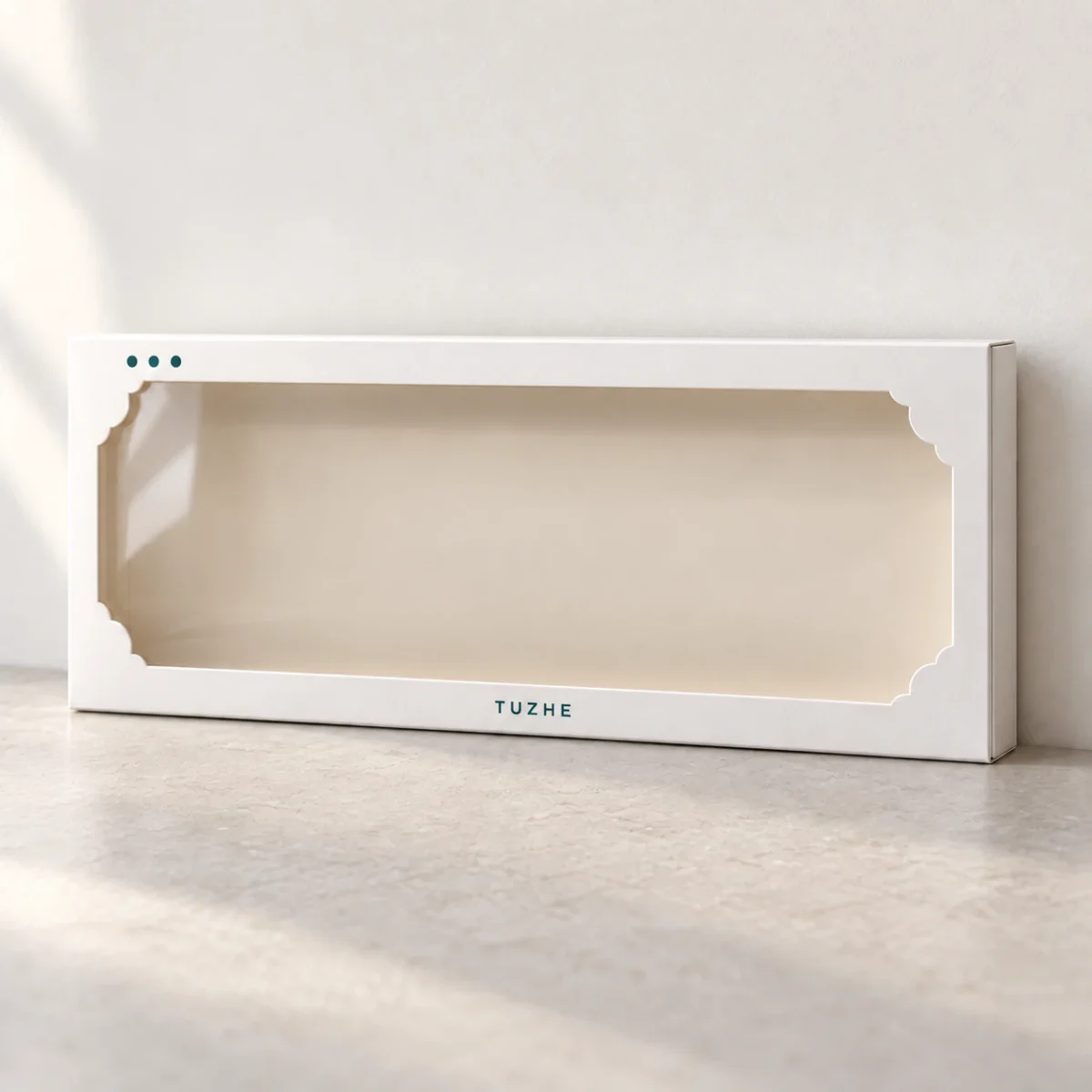 AI design concept: upright closed white cookie carton with clear window, flat pale backing and centered teal TUZHE wordmark