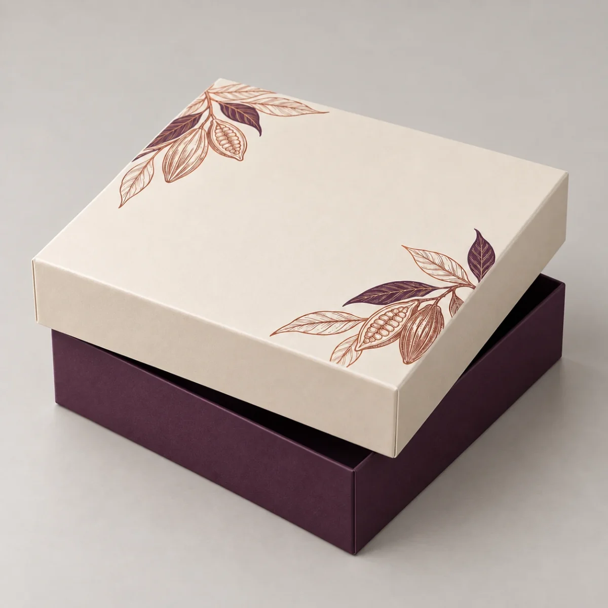 Chocolate Gift Box Cavities: Why Piece Count Alone Does Not Define the Insert Square chocolate gift box concept with the removable ivory lid slightly lifted above the deep aubergine base
