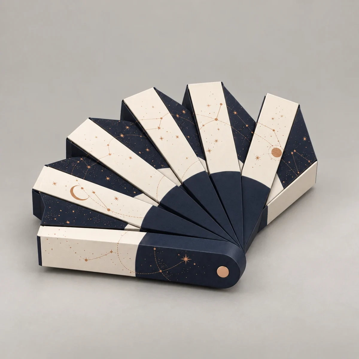 Collapsible Gift Boxes: Checking Corner Panels Before Approving a Sample Compact fan view of the seven-piece gift box concept with seven closed cartons and consistent constellation artwork