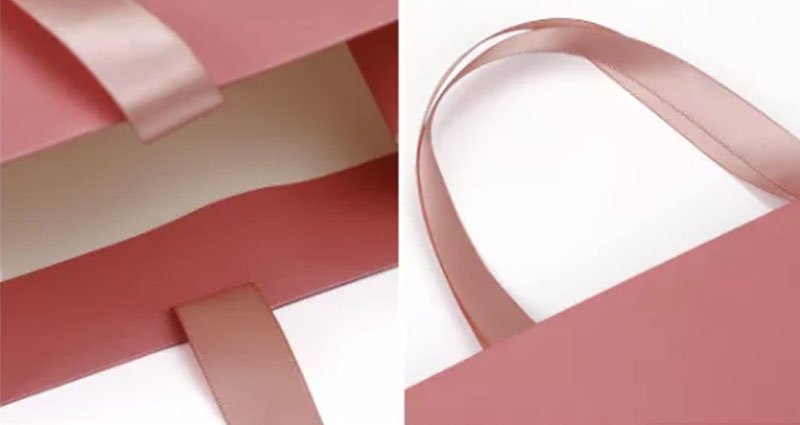 Structure and component detail for paper gift bags with ribbon handles