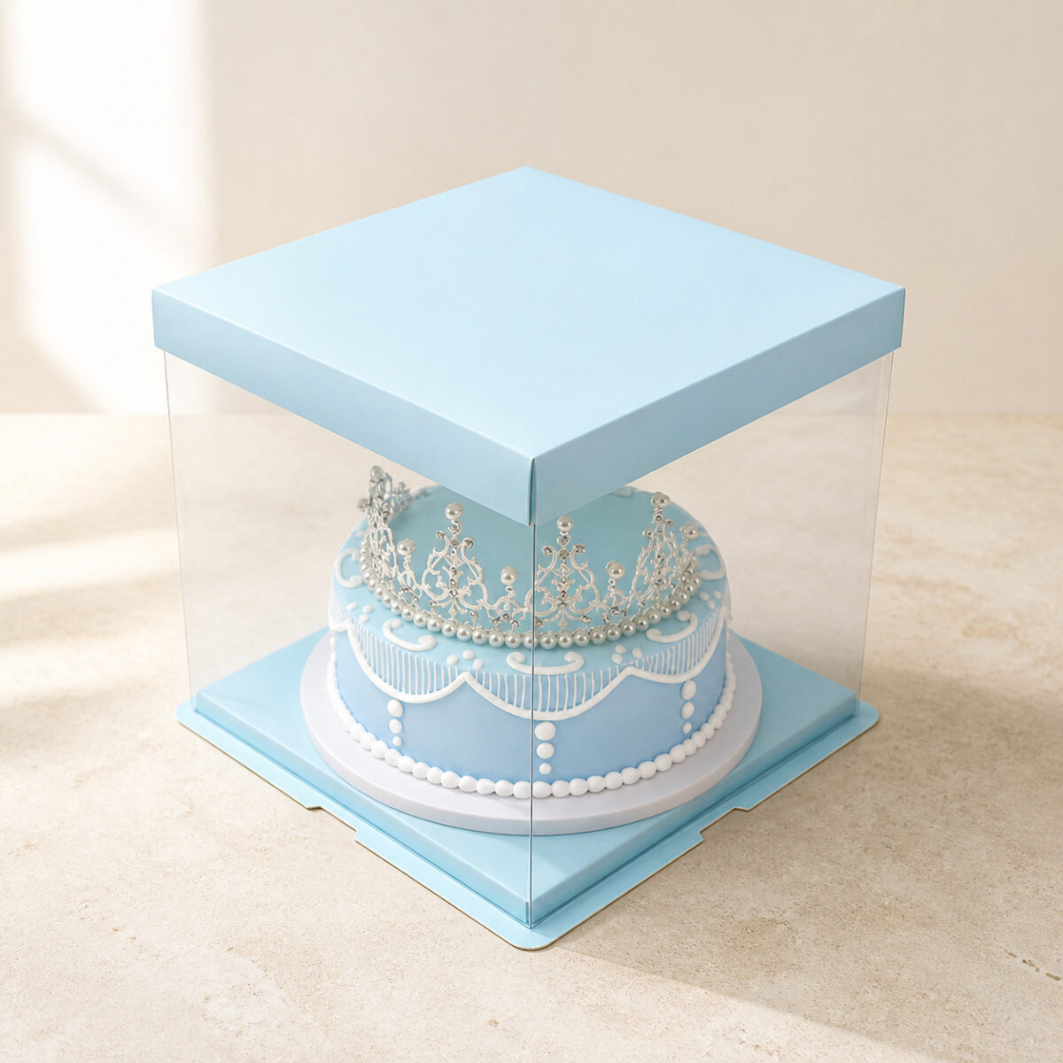 Blue Frame Cake Boxes with Clear Walls Clear square cake box with a blue lid and blue base displaying a blue celebration cake