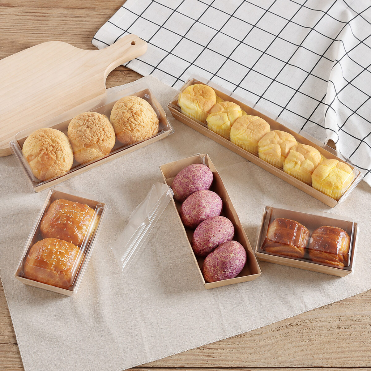 Clear Cover Pastry Assortment Boxes Kraft pastry trays with clear covers holding muffins choux buns and purple pastries