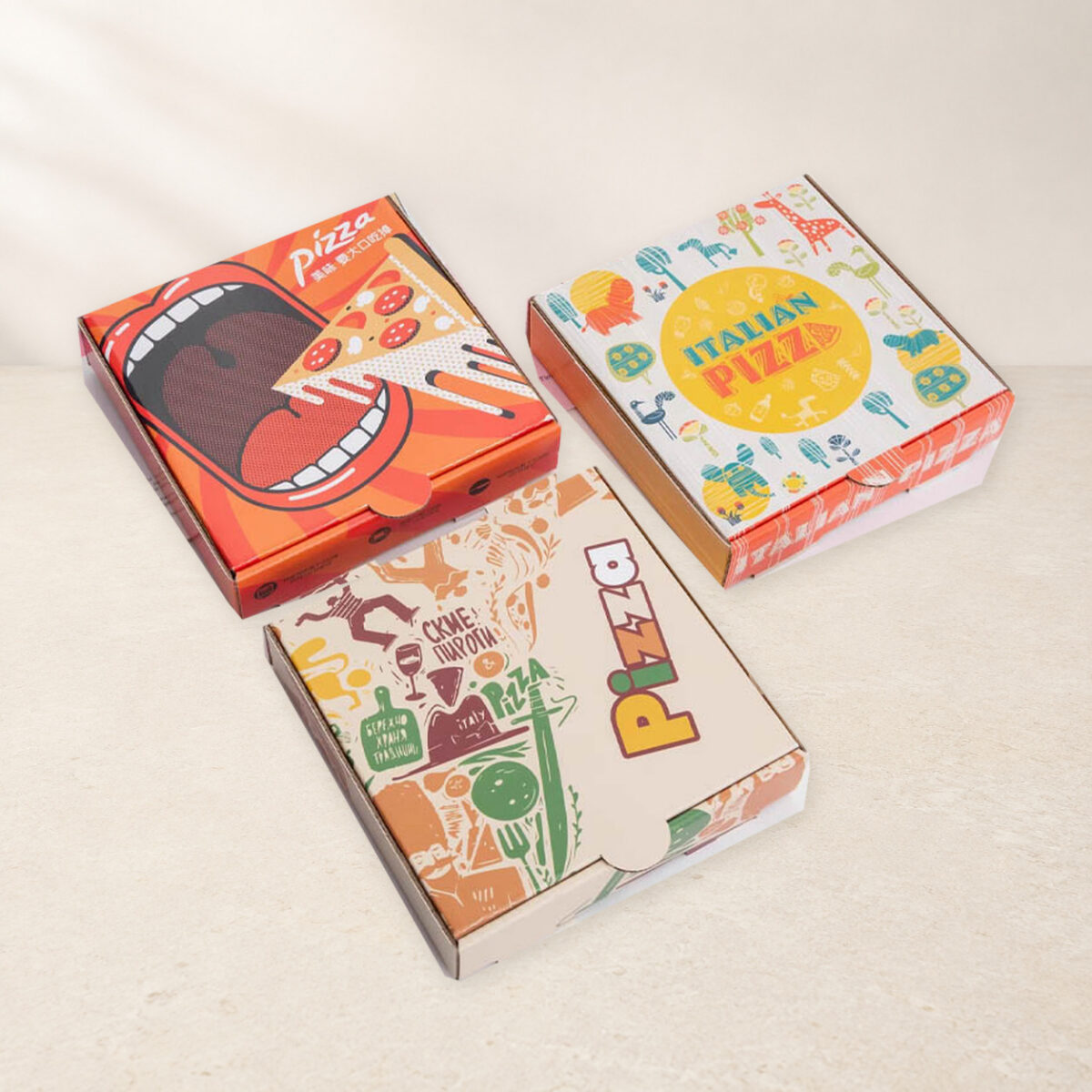 Full-Color Printed Pizza Boxes Three printed pizza boxes with different colorful lid designs