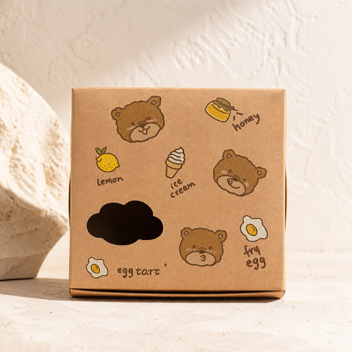Closed kraft egg tart carton with a cloud-shaped window and printed bear illustrations