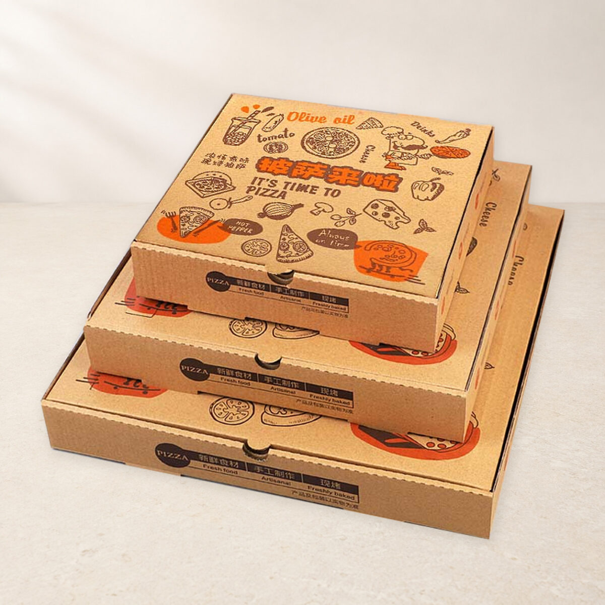 Printed Kraft Pizza Boxes for Takeaway Menus Three stacked kraft pizza boxes in graduated sizes with matching printed artwork